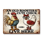An Old Rooster And A Cute Chick Live Here